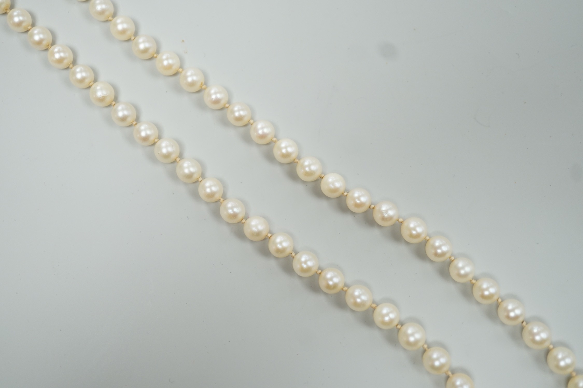 A Mikimoto single strand cultured pearl necklace, with sterling clasp, 48cm, with Mikimoto pouch.